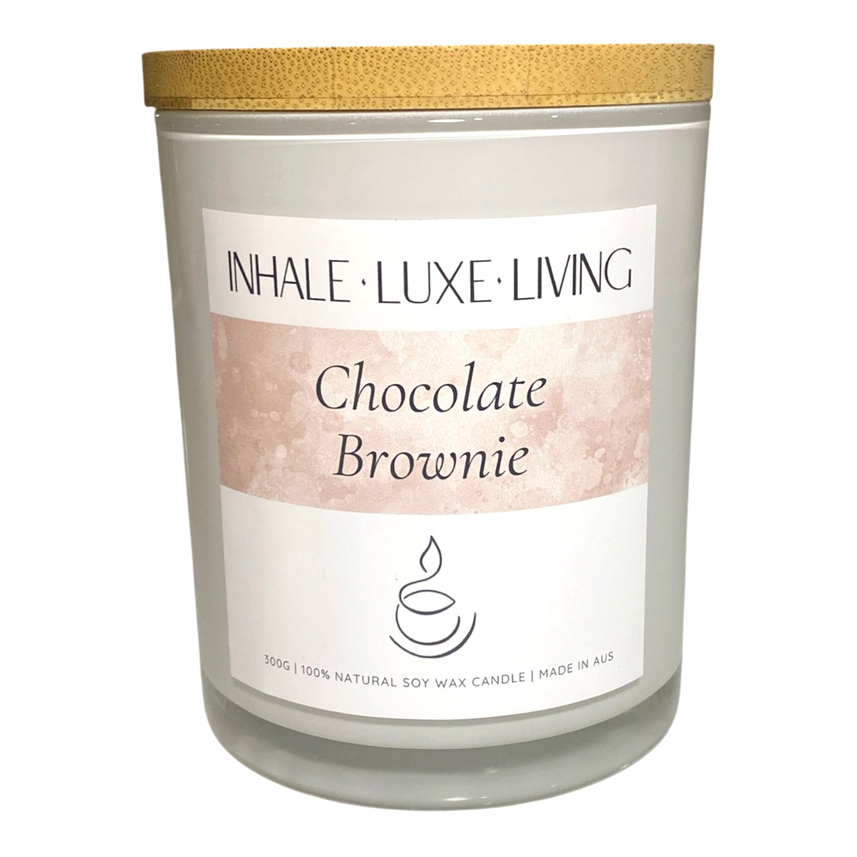 Candle with 'Inhale Luxe Living' label on a white background